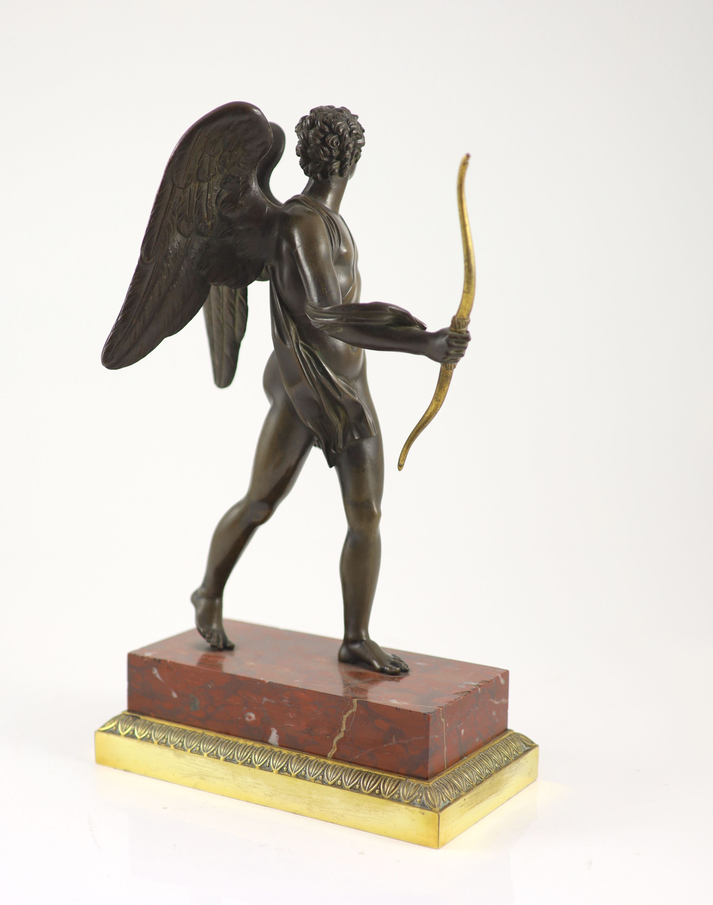A 19th century bronze figure of Eros, H 37cm. W 22cm. D 12cm.